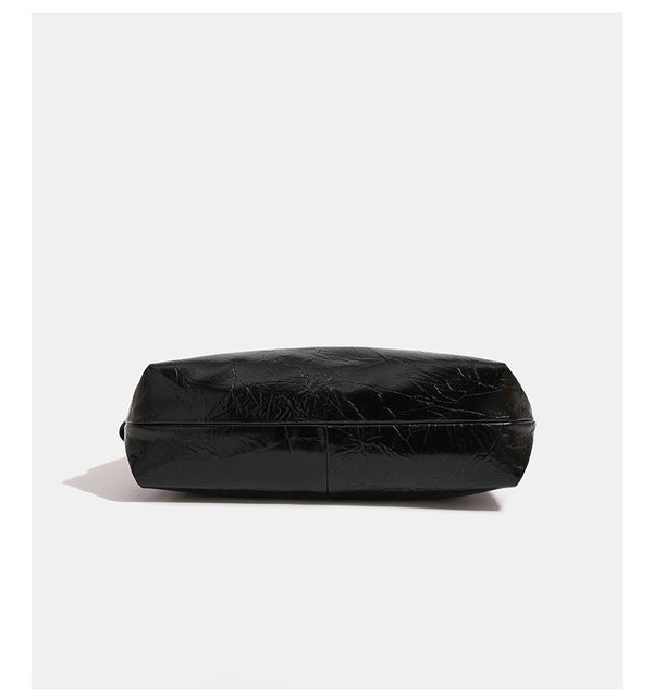 Glossy crinkled hobo shoulder bag with gold-tone logo hardware and adjustable strap, detail view 8