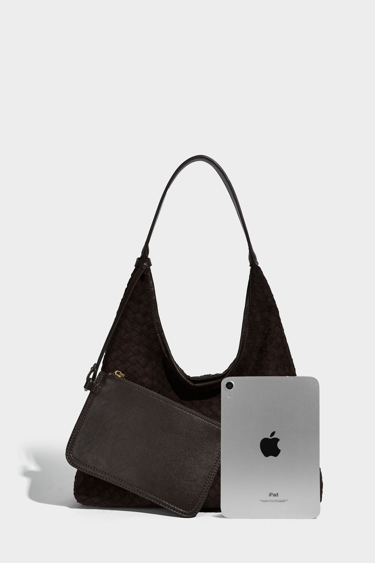 Large slouchy woven hobo tote bag with curved shoulder strap and triangular silhouette, detail view 11
