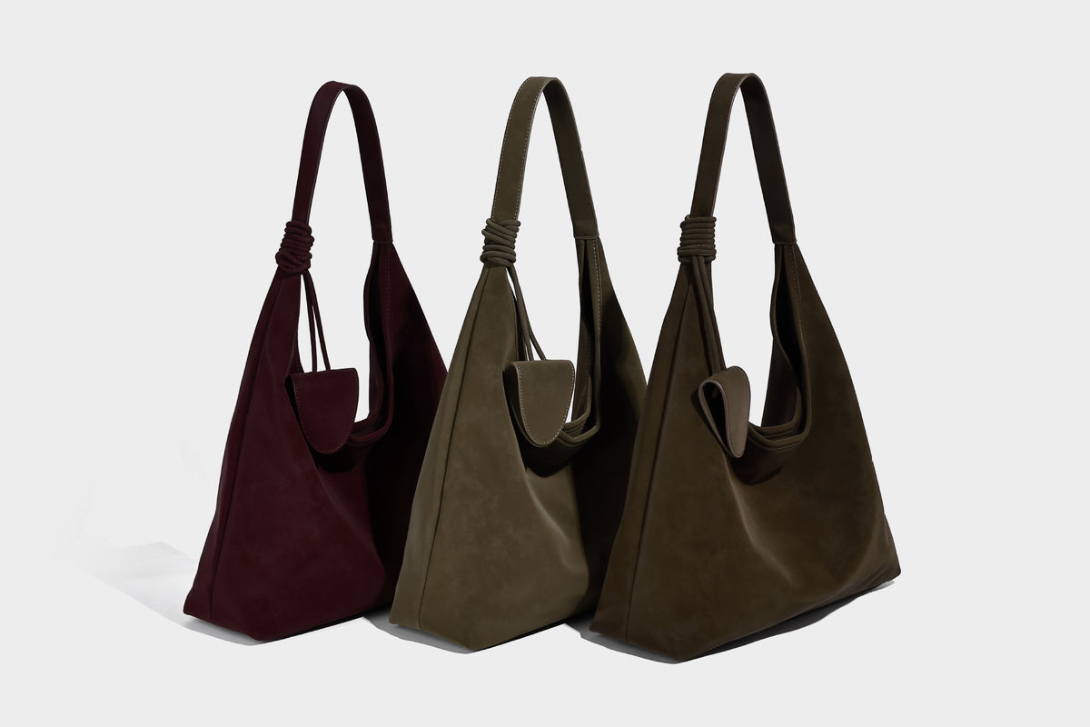 Slouchy oversized matte suede-look shoulder tote bag with knotted strap and attached front flap pouch, detail view 9