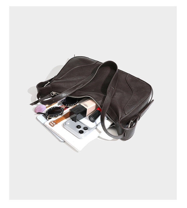 Dark brown curved zip-top hobo shoulder bag with slim adjustable strap and silver-tone hardware, detail view 16