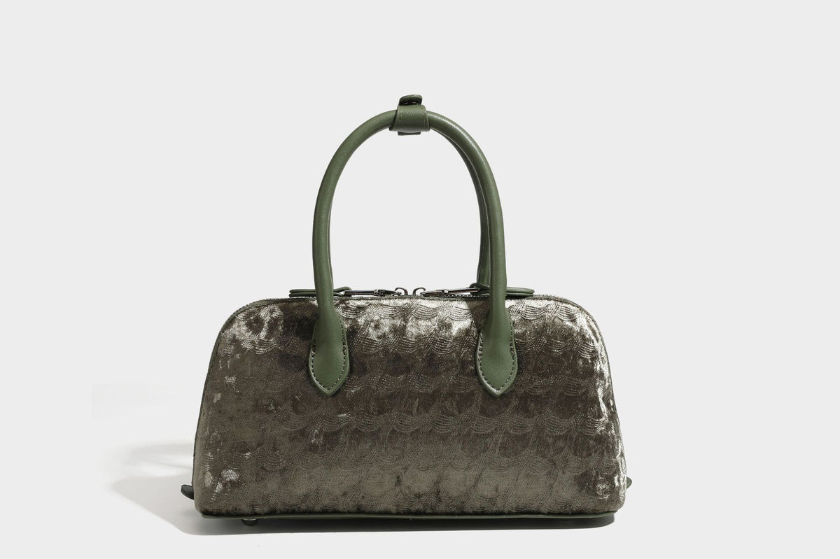 Small structured satchel bag in dark brown velvet-like textured finish with leather-look trim, silver-tone turn-lock bar