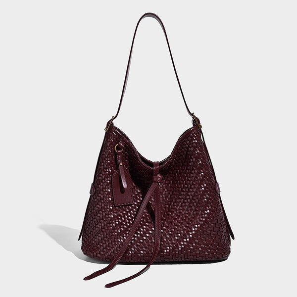 Slouchy woven-texture bucket shoulder bag with tassel tie closure and gold-tone hardware, detail view 10