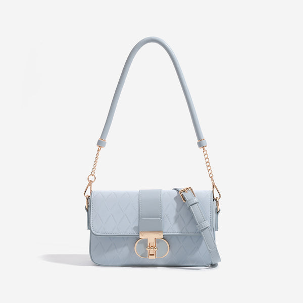 Compact rectangular quilted flap crossbody bag with gold-tone turn-lock closure and chain strap, front view