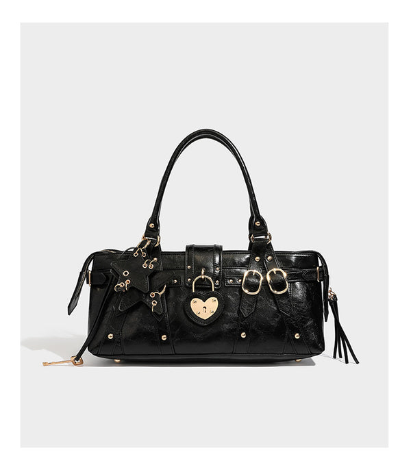 Dark brown glossy crinkled leather-look barrel bag with gold heart lock, dome studs, star charm, dual top handles and, detail