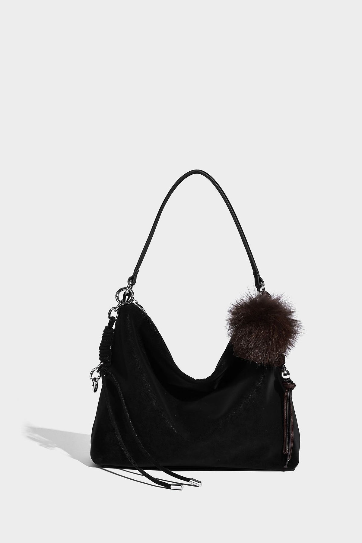 Slouchy matte-finish hobo shoulder bag with tassel cords, silver-tone hardware, and faux-fur pom charm, detail view 31