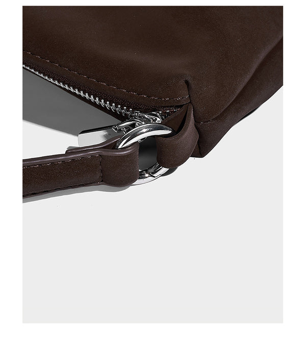 Slouchy matte-finish hobo shoulder bag with tassel cords, silver-tone hardware, and faux-fur pom charm, detail view 12