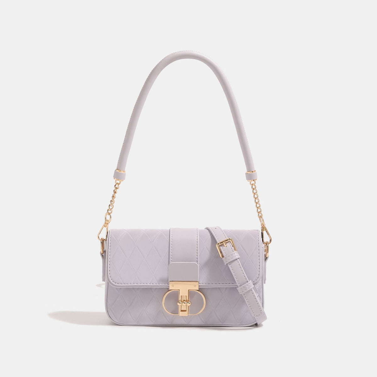 Small structured quilted diamond flap bag in mint green with gold turn-lock closure and detachable chain crossbody strap