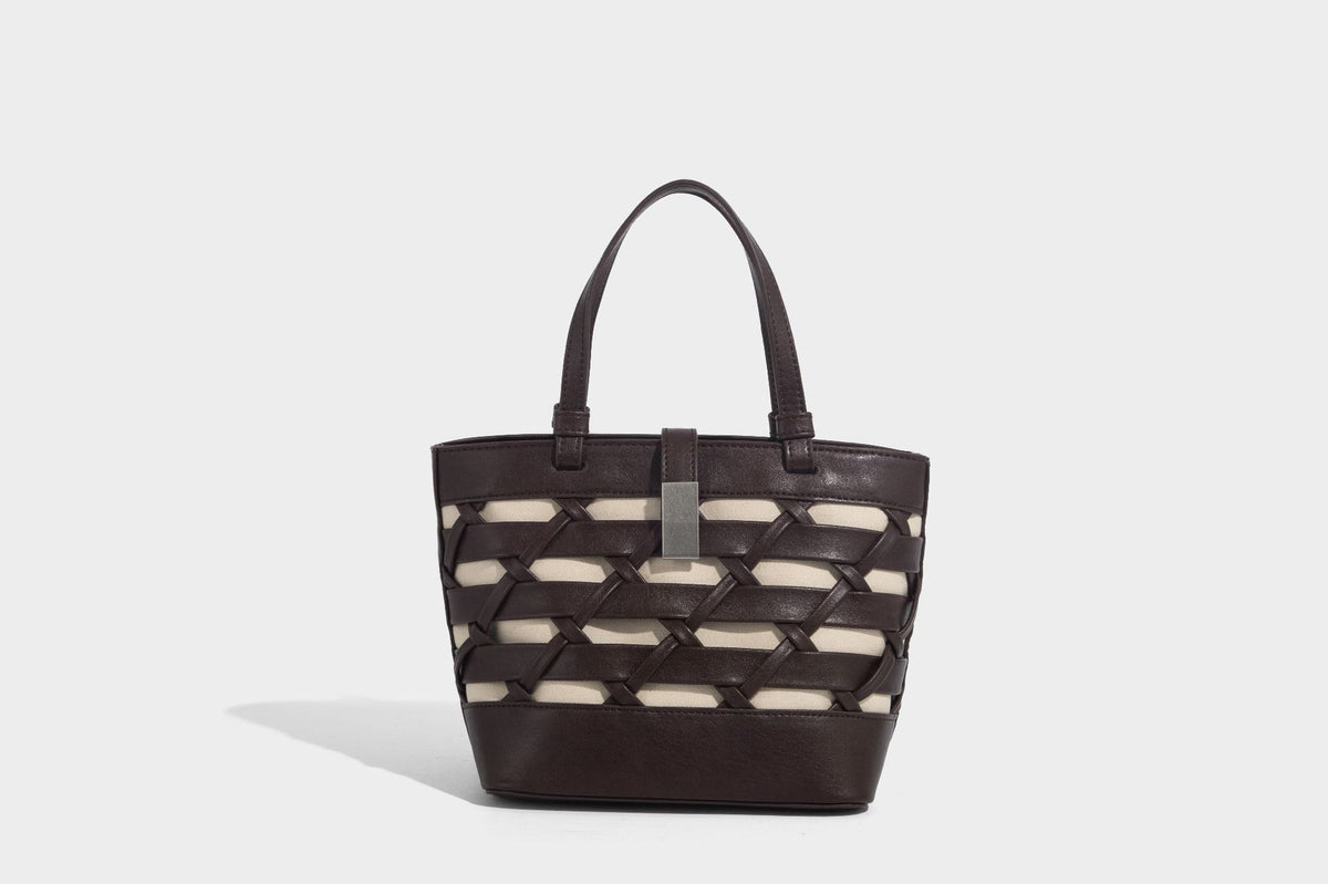 Structured woven lattice tote bag with cream lining, dual top handles, detachable crossbody strap, and silver-tone hardware