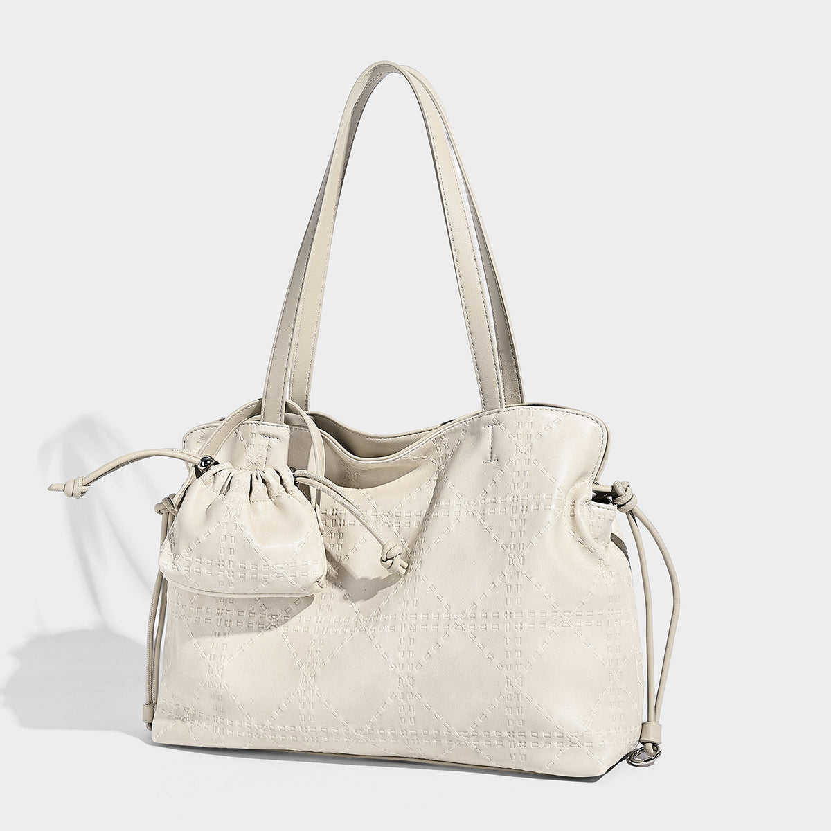 Large embossed leather-look tote shoulder bag in ivory cream with dual long straps, side drawstring cinch, and detachable