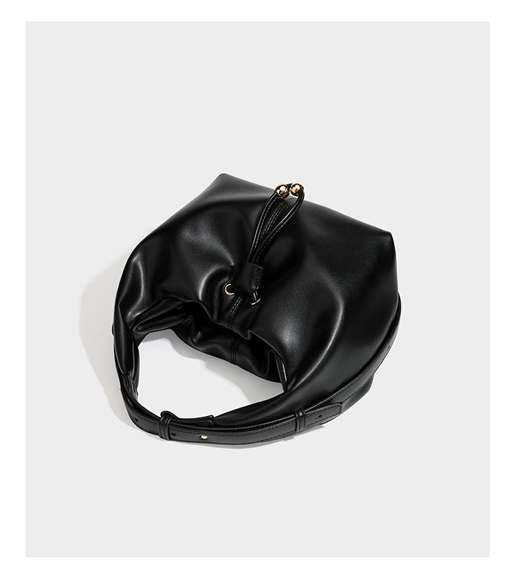 Slouchy hobo bag with smooth leather-look finish, drawstring cinch closure, and gold-tone bead hardware, detail view 11