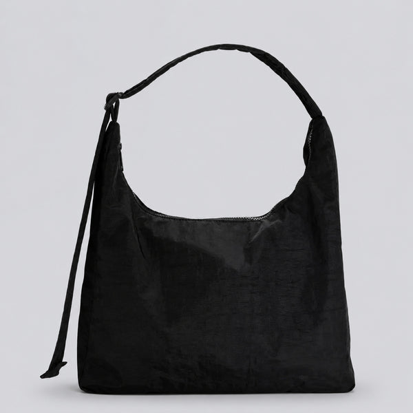Multicolor plaid and star print hobo shoulder bag with knotted strap and silver-tone zip closure, detail view 6