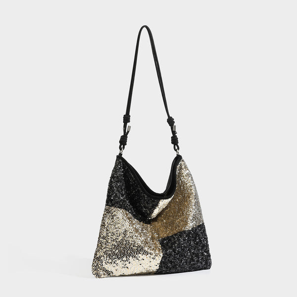 Lässig fallende Schulter-Tote mit Patchwork-Pailletten, Colorblocking-Einsätzen in Schwarz-Gold oder Creme-Silber und verstellbarem schmalem Riemen