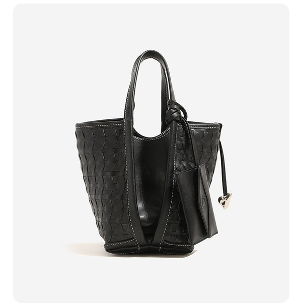 Woven embossed leather-look bucket bag with triangular texture pattern, gold-tone hardware, and attached mini snap pouch