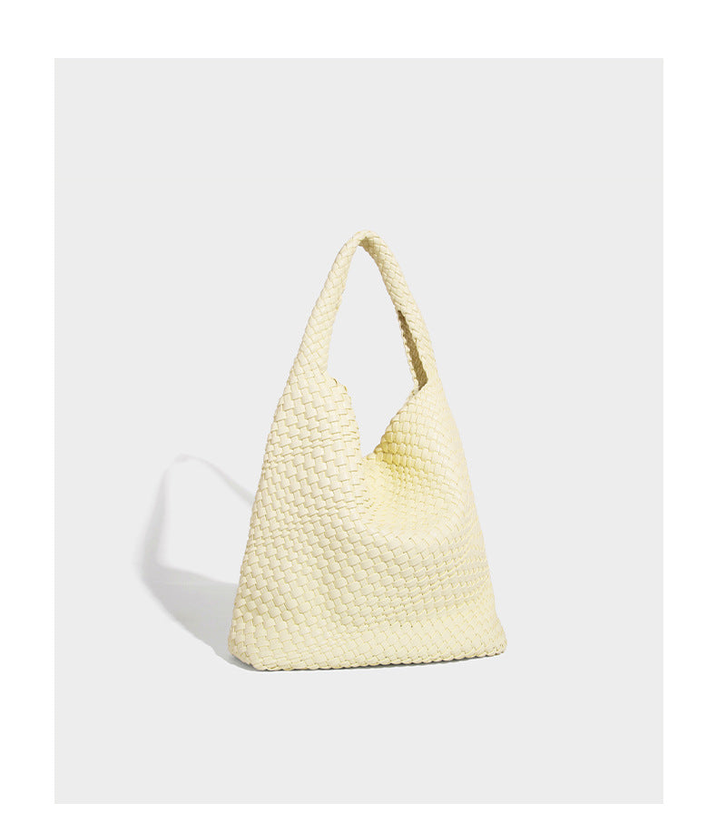 Soft hand-woven slouchy hobo tote bag with knotted tassel charm and single looped shoulder strap, detail view 27