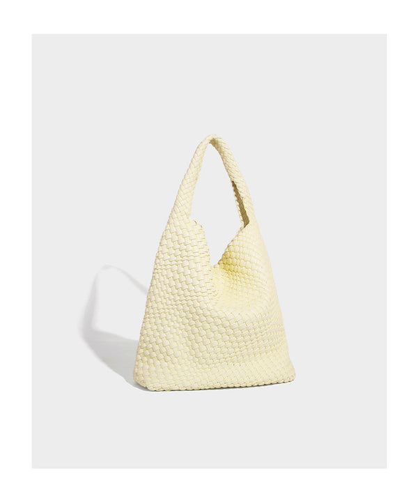 Soft hand-woven slouchy hobo tote bag with knotted tassel charm and single looped shoulder strap, detail view 27