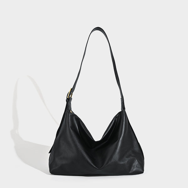 Large slouchy hobo shoulder bag in smooth black leather-look finish with gold-tone buckle hardware and adjustable strap