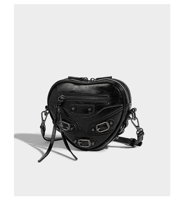 Mini heart-shaped crossbody bag with glossy crinkled finish and moto buckle hardware, detail view 10