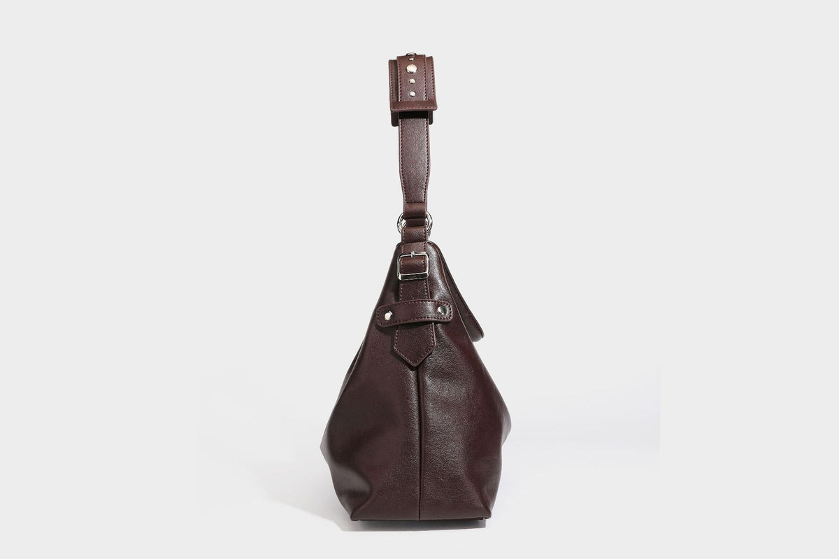 Large slouchy hobo shoulder bag in dark brown with smooth leather-look finish, adjustable strap, and silver-tone hardware