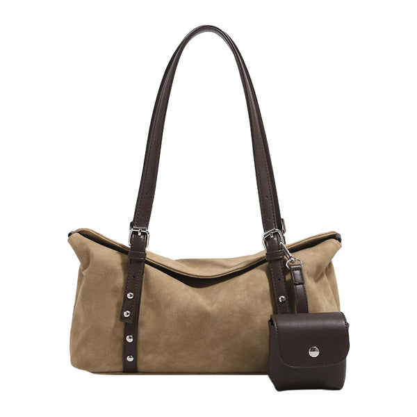 Soft slouchy suede-look shoulder tote with dark brown leather-look trim, silver-tone stud hardware, and attached snap-front