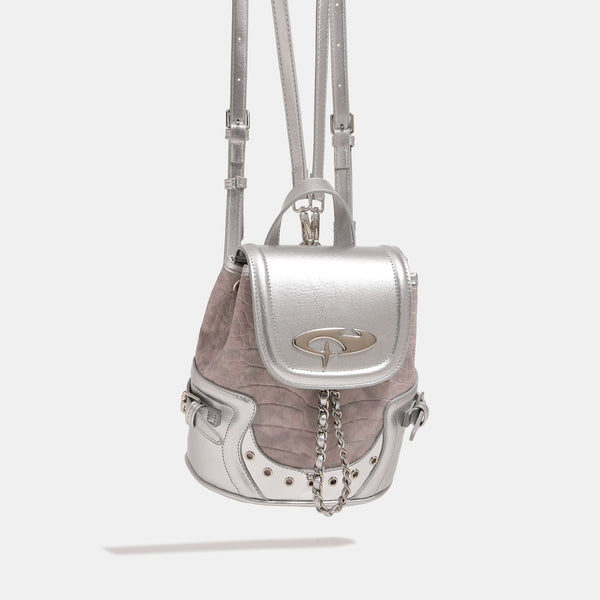 Croc-embossed mini backpack with silver metallic leather-look trim, decorative chain, and metal logo clasp, front view