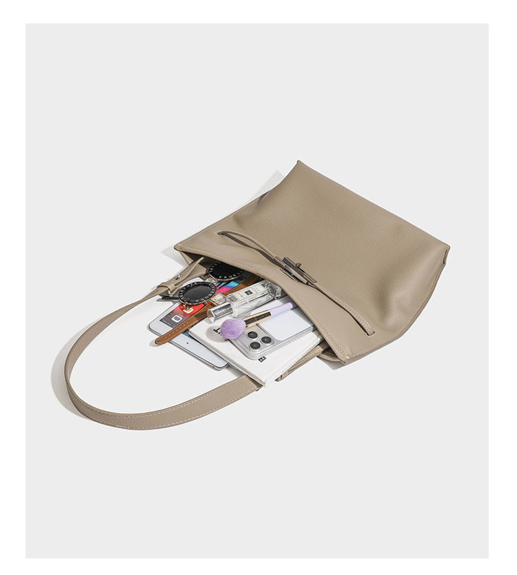 Large structured tote bag in pebbled leather-look finish with silver-tone twist-knot front detail and adjustable shoulder