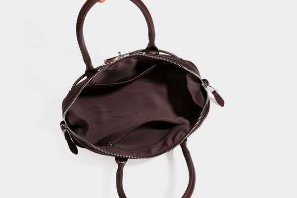 Small structured satchel bag in dark brown velvet-like textured finish with leather-look trim, silver-tone turn-lock bar