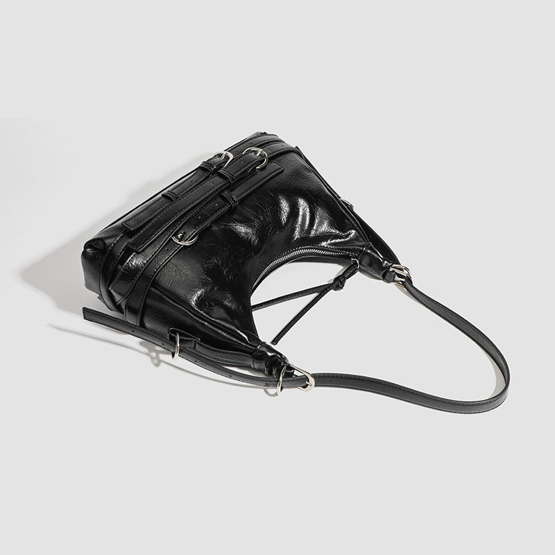 Slouchy hobo shoulder bag in glossy crinkled leather-look finish with silver-tone buckle hardware and slim adjustable strap