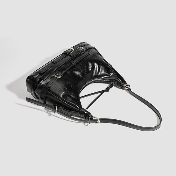 Slouchy hobo shoulder bag in glossy crinkled leather-look finish with silver-tone buckle hardware and slim adjustable strap
