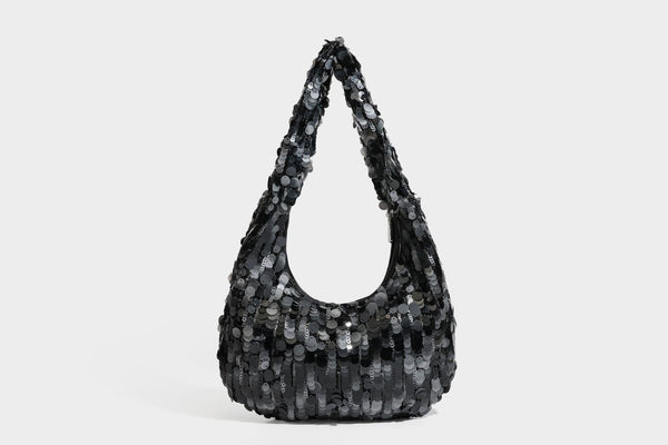 Slouchy crescent hobo shoulder bag covered in overlapping reflective sequin discs with a single integrated strap and top-zip
