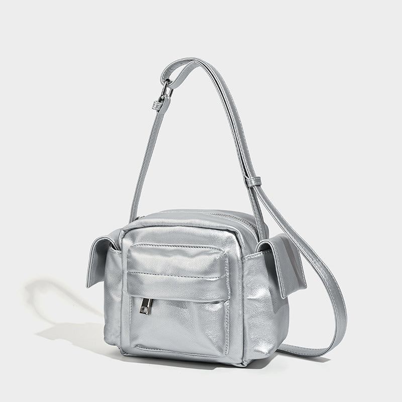 Boxy leather-look crossbody bag with front zip pockets, top zip closure, and long adjustable strap, detail view 3