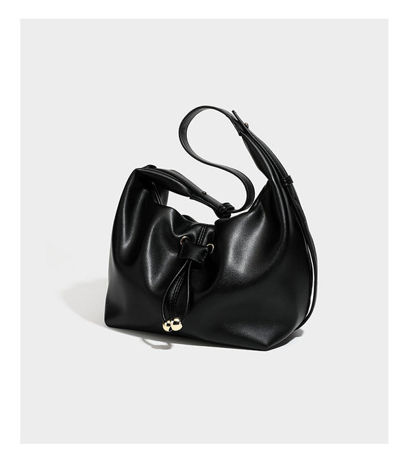 Slouchy hobo bag with smooth leather-look finish, drawstring cinch closure, and gold-tone bead hardware, detail view 13