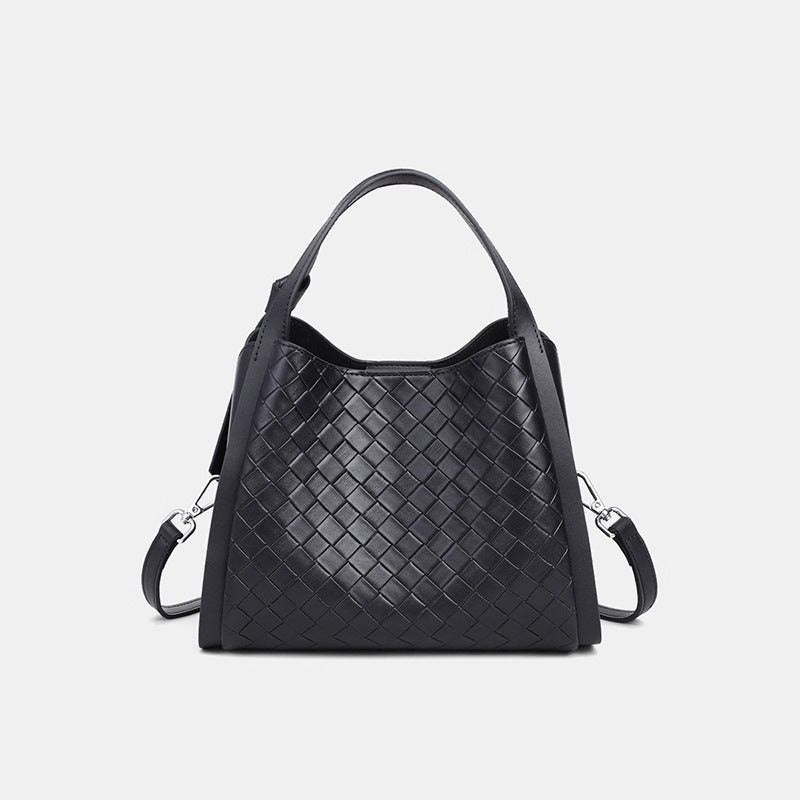 Black woven leather-look bucket tote bag with dual top handles and detachable shoulder strap, silver-tone hardware and zip