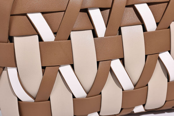 Small structured woven lattice tote bag with dual top handles and detachable shoulder strap in brown and cream leather-look