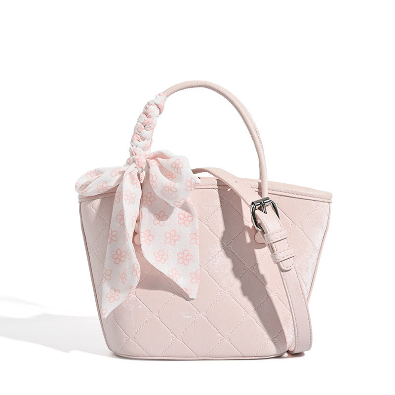 Quilted leather-look mini tote bag with printed scarf bow on braided top handle and silver-tone hardware, detail view 5