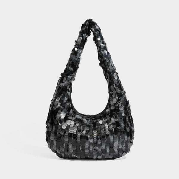 Slouchy crescent hobo shoulder bag covered in overlapping reflective sequin discs with a single integrated strap and top-zip