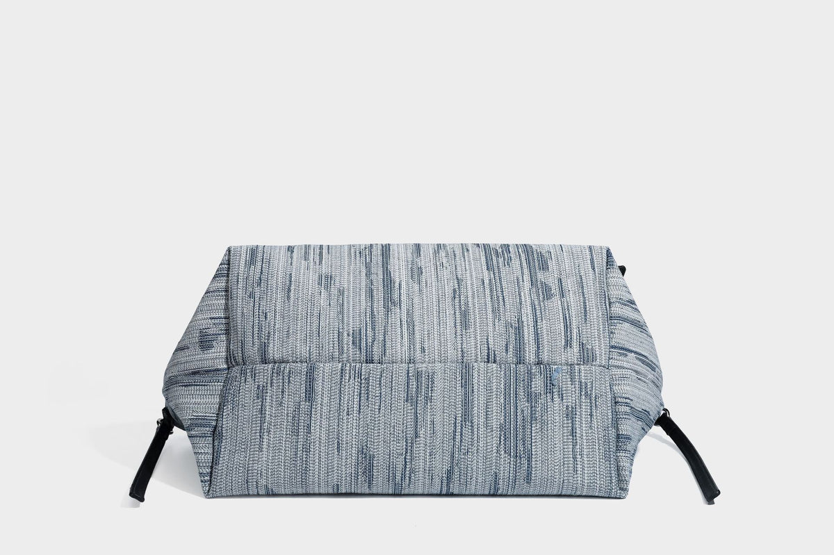 Large slouchy woven-texture shoulder tote bag with slim leather-look straps, side cinch ties, and silver-tone hardware