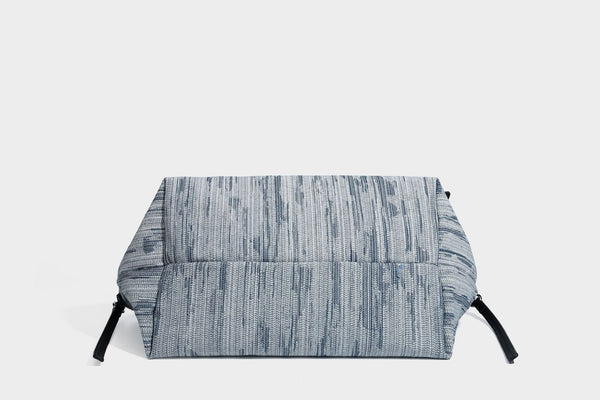 Large slouchy woven-texture shoulder tote bag with slim leather-look straps, side cinch ties, and silver-tone hardware