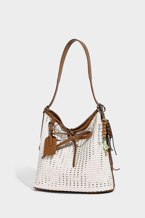 Slouchy open-weave shoulder tote bag with leather-look tan trim, tie-front closure, and long adjustable strap, detail view 9