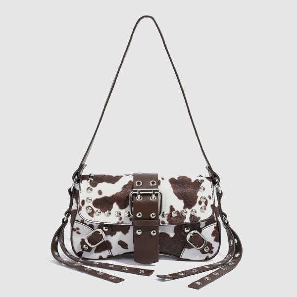 Mini square cow-print leather-look shoulder bag with metal stud hardware and dual carry straps, detail view 3
