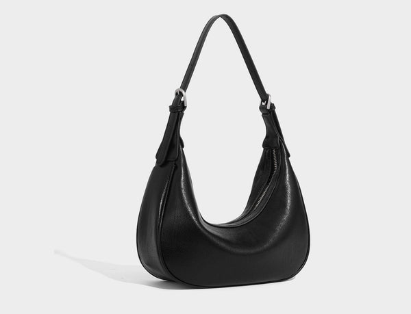Crescent half-moon shoulder bag in pebbled leather-look finish with adjustable strap and silver-tone hardware, detail view 20