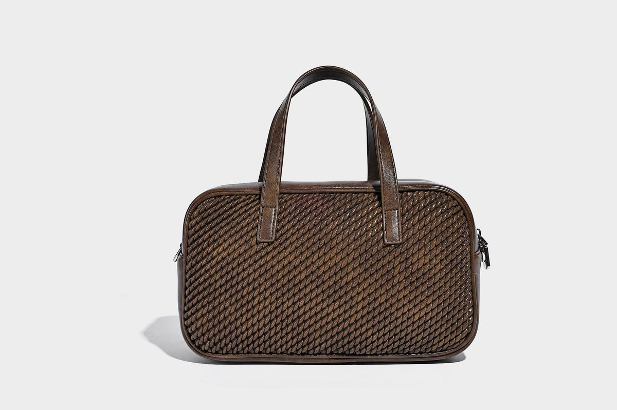 Structured woven-texture front top-handle handbag with zip closure, dual handles, detachable shoulder strap, and matching