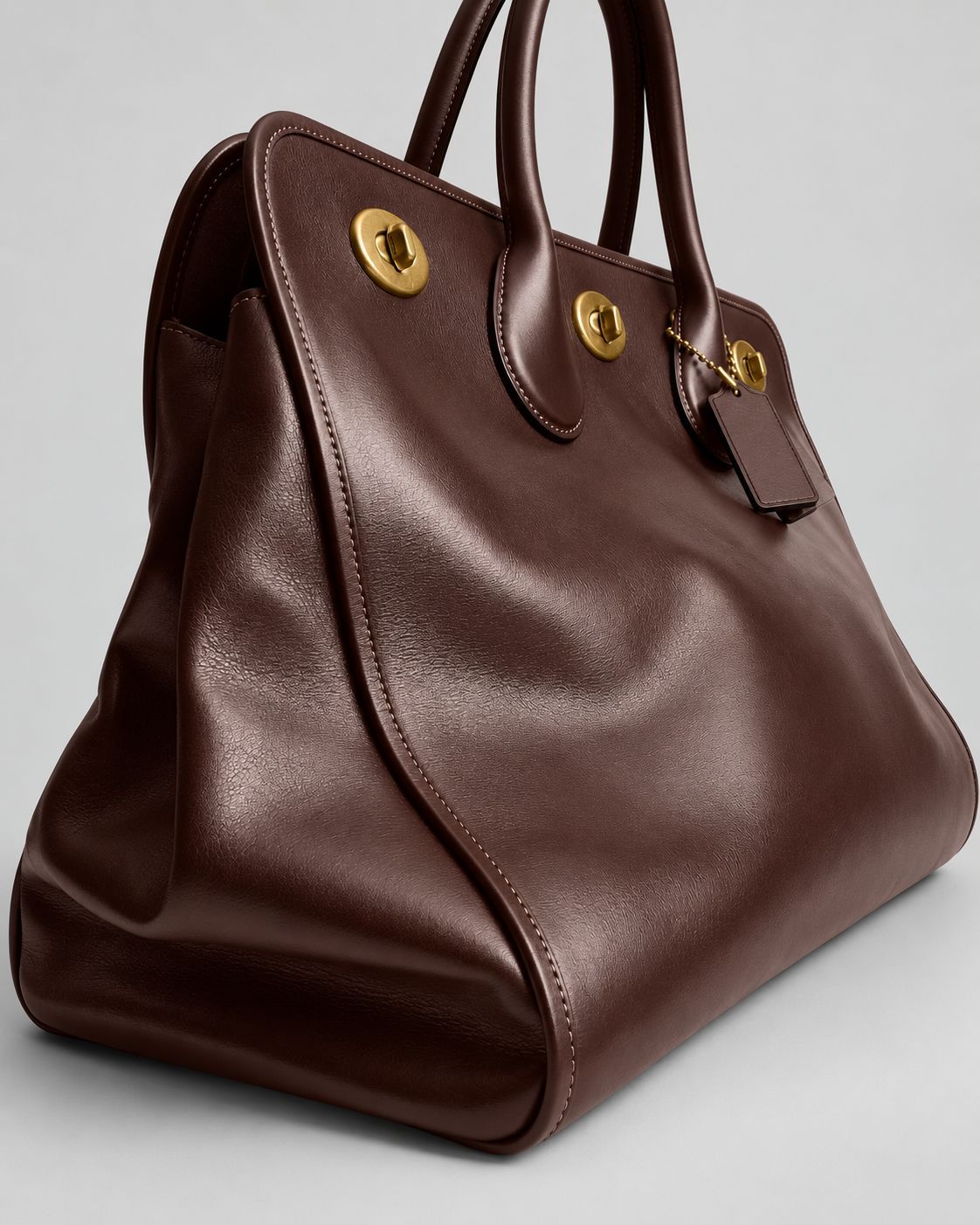 Structured leather-look tote bag with three gold-tone turn-lock closures and double rolled top handles, detail view 22