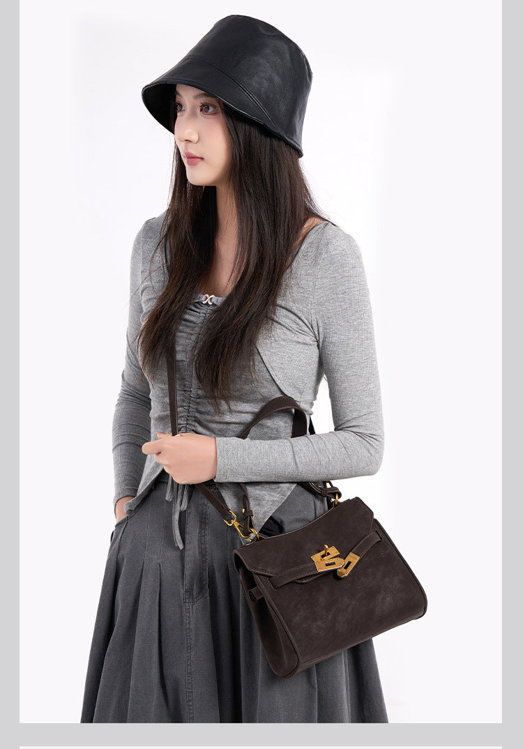 Structured dark brown flap satchel with gold-tone turn-lock hardware and detachable shoulder strap, detail view 8