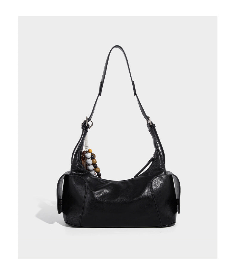 Soft pebbled leather-look hobo shoulder bag with zip top closure, side flap pockets, and silver-tone hardware, detail view 11
