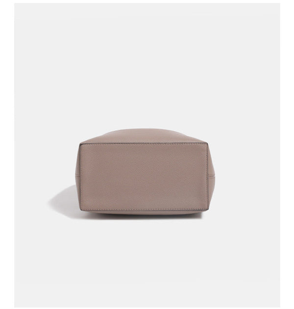 Structured pebbled leather-look bucket bag with gold-tone turn-lock clasp and looped top handle, detail view 15