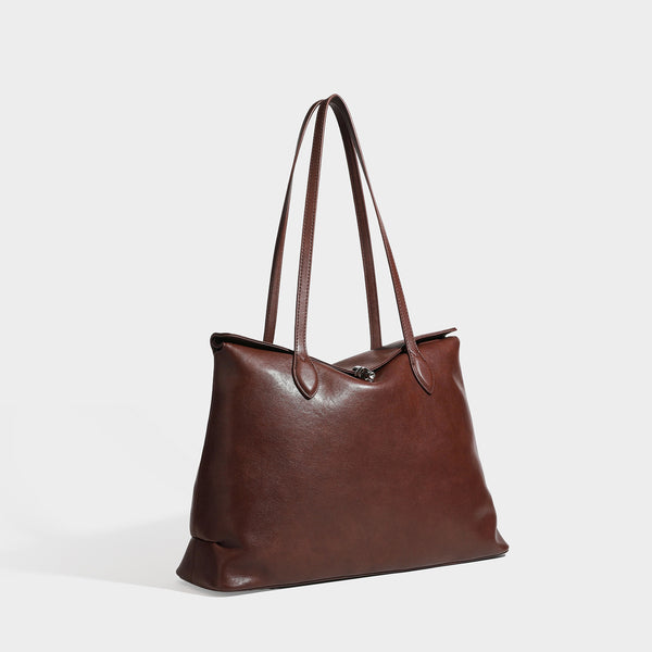 Large leather-look tote shoulder bag with slim double straps and silver-tone turn-lock closure, front view