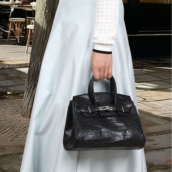 Croc-embossed structured trapezoid satchel with silver turn-lock hardware, rounded top handles, and detachable shoulder
