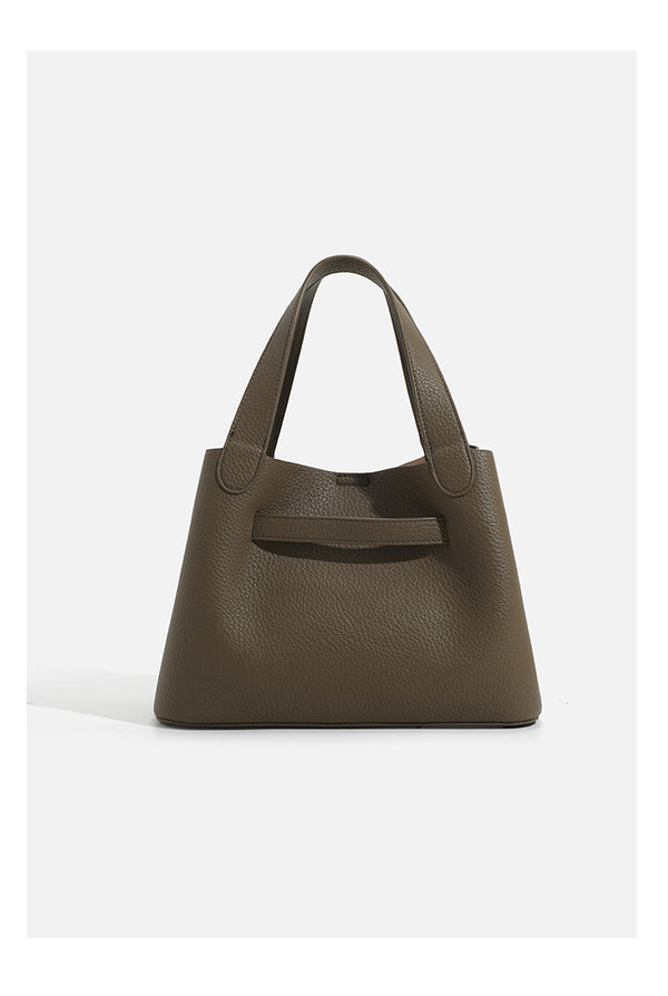 Pebbled trapezoid tote bag with gold turn-lock strap detail and matching snap pouch, detail view 11
