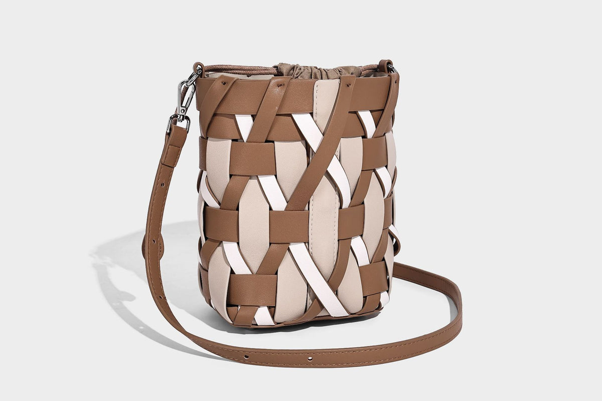 Small woven lattice bucket bag in tan and cream leather-look strips with drawstring top and detachable crossbody strap
