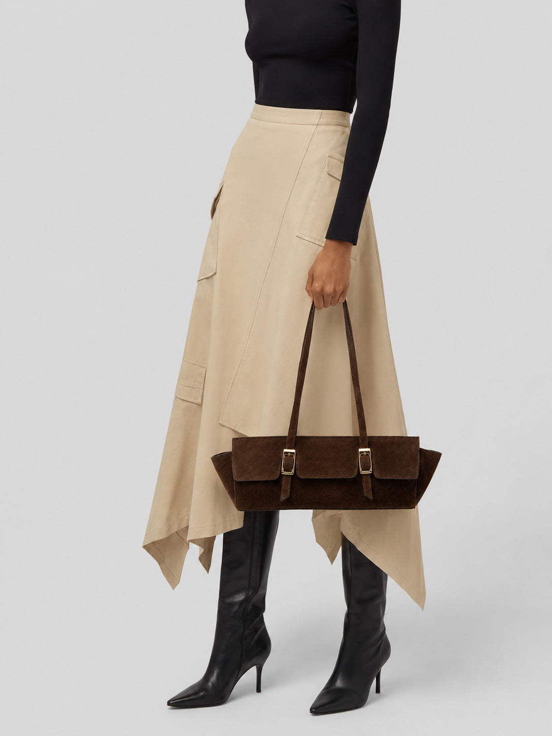 Wide trapezoid tote bag with matte suede-like finish, dual gold-tone buckle front pockets, and double flat shoulder straps